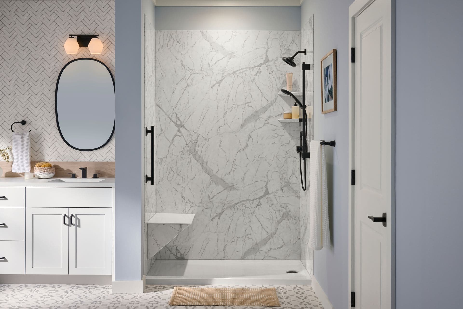 A photo of a BathWraps Glacier Marble Transitional Safety shower with a bench and black fixtures and vertical grab bar.